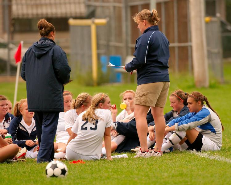 Girls Soccer Coach, Jen Meade, talks to her disappointed players after losing an a close game to Norwood on Tuesday September 29.