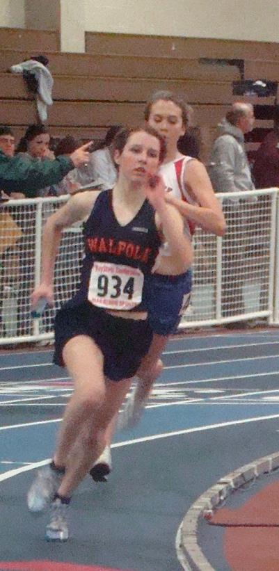 Junior Brigette Lawton pushes through the last lap of the 4x400 relay on Thursday, December 17.