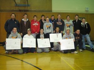 Walpole wrestling team poses for a picture at the Sectional Meet in Needham.
