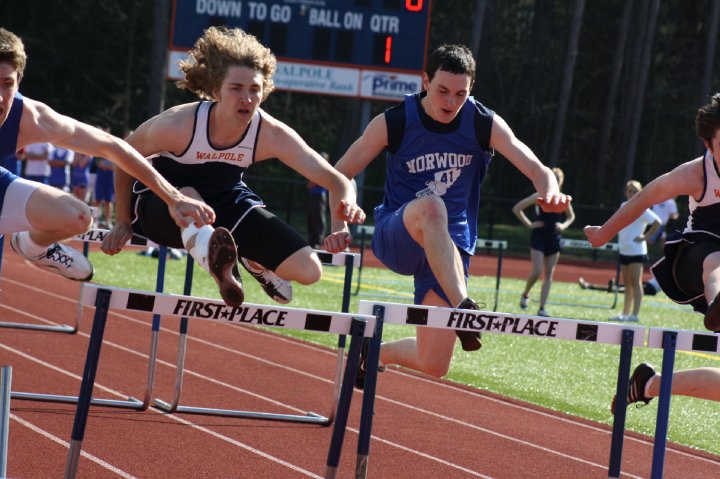 Junior Jackson Paslaski races in the 110m hurdles against a Norwood competitor.