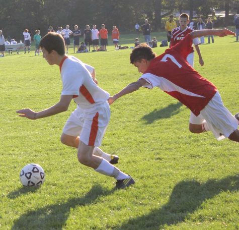 A Rebel midfielder blows by the opposing teams defender (Photo/ Jake Moser)
