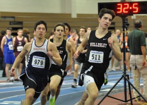 A Walpole runner fights for a lead against their Herget foes, the Wellesley Raiders.
