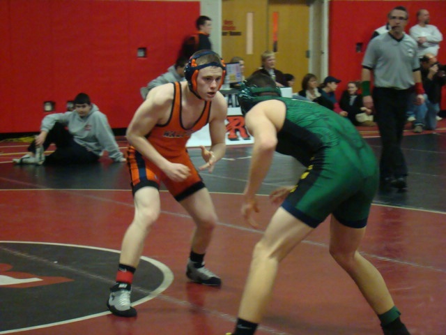 A Walpole wrestler moves in for an attack.