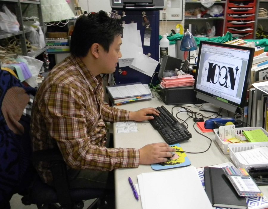 Mr. Kim edits a poster for the Dance Company show.