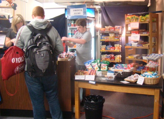 A student purchases treats from the Rebel Closet