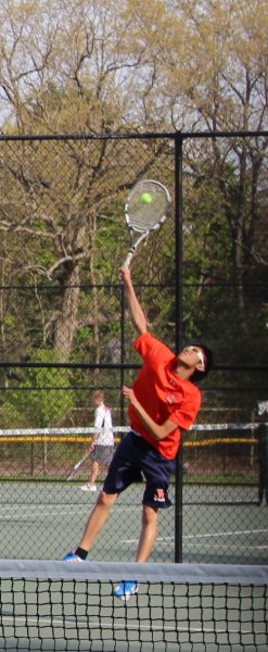 A Rebel tennis player serves the ball