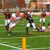 A football player evading a defender in a previous game.(photo/ Tim Hoffman).