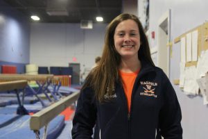 Kady Sullivan poses before meet against Newton North. 