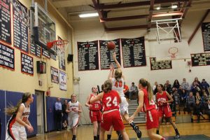 Sophomore Summer King takes an aggressive drive against Milton's defense.