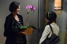 Mona gives Doctor Sullivan a welcome back gift.