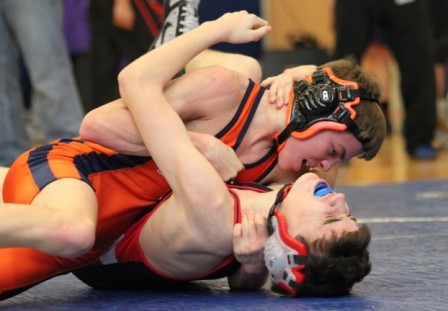 The Rebels 106 pounder works to pin his opponent. 