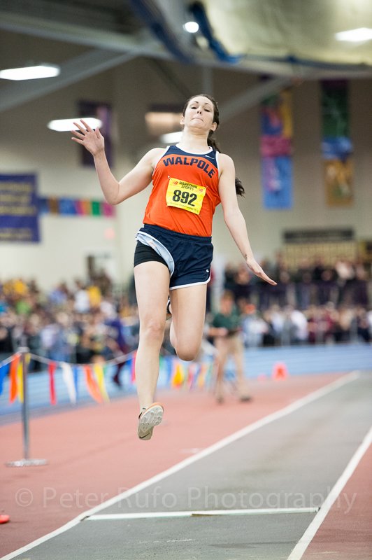 A Walpole athlete competes in the Long Jump at the Division II State Meet