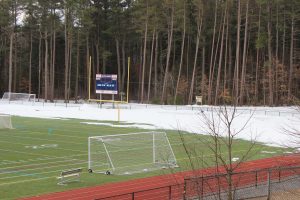 The Walpole High School track is covered with snow now, but soon it will be covered with runners.