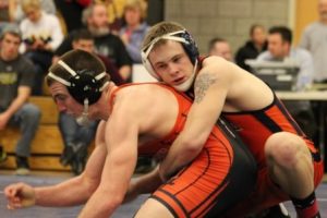 The Rebel's 182 lbs. wrestler rides his opponent in the Sectional Tournament Finals. 