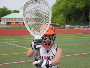 The Rebels' goalie poses for a picture during her warmups for the Hingham game on May 29.