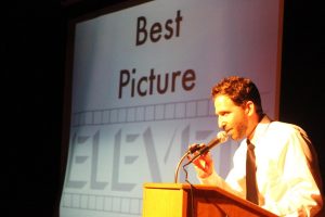 Mr. Alan presents the award for Best Picture at Film Festival Awards Night.