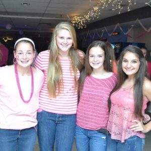 Students at last year's dance dressed in pink.