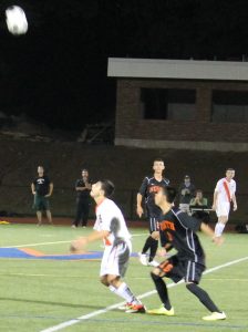 A Walpole attacker waits for an incoming punt.