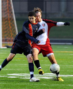 A Walpole attack tries to win the ball