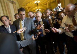 Reporters swarm Senate majority leader Harry Reid (D-NV) during the government shutdown.