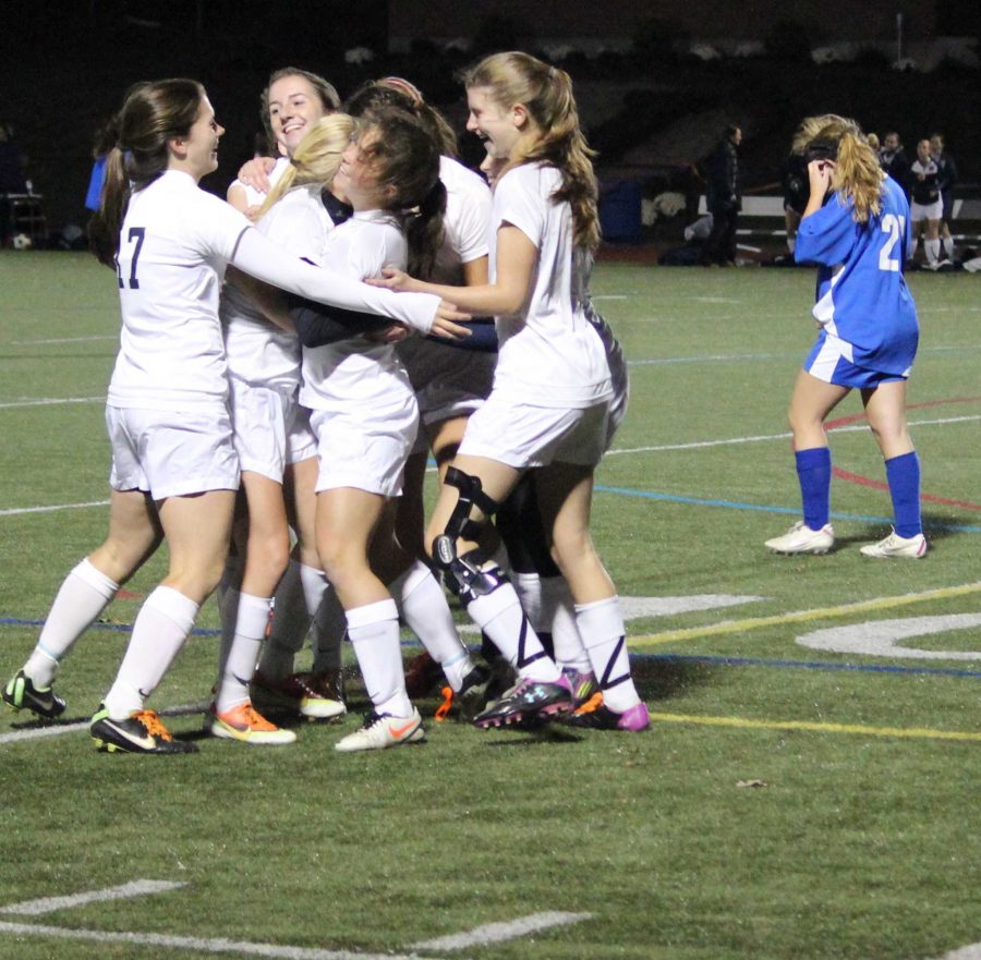Girls Soccer celebrates after their win.