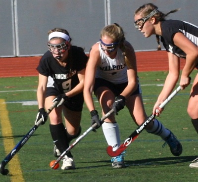 A Walpole player gathers the ball before scoring the game winning goal.
