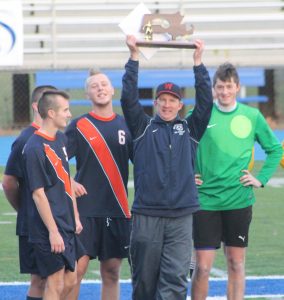 Coach Delaney and the captains are awarded the South Sectional trophy.