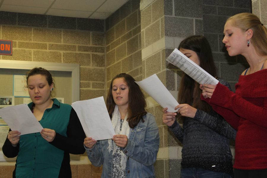 Members of the Altogethers perform carols at Parent-Teacher Conference night