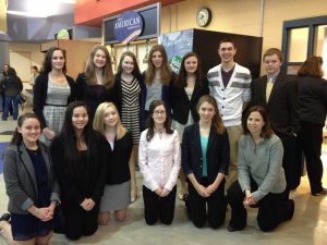 The Speech Team celebrates a successful performance at Newton-South High School where four students received a bid for states.