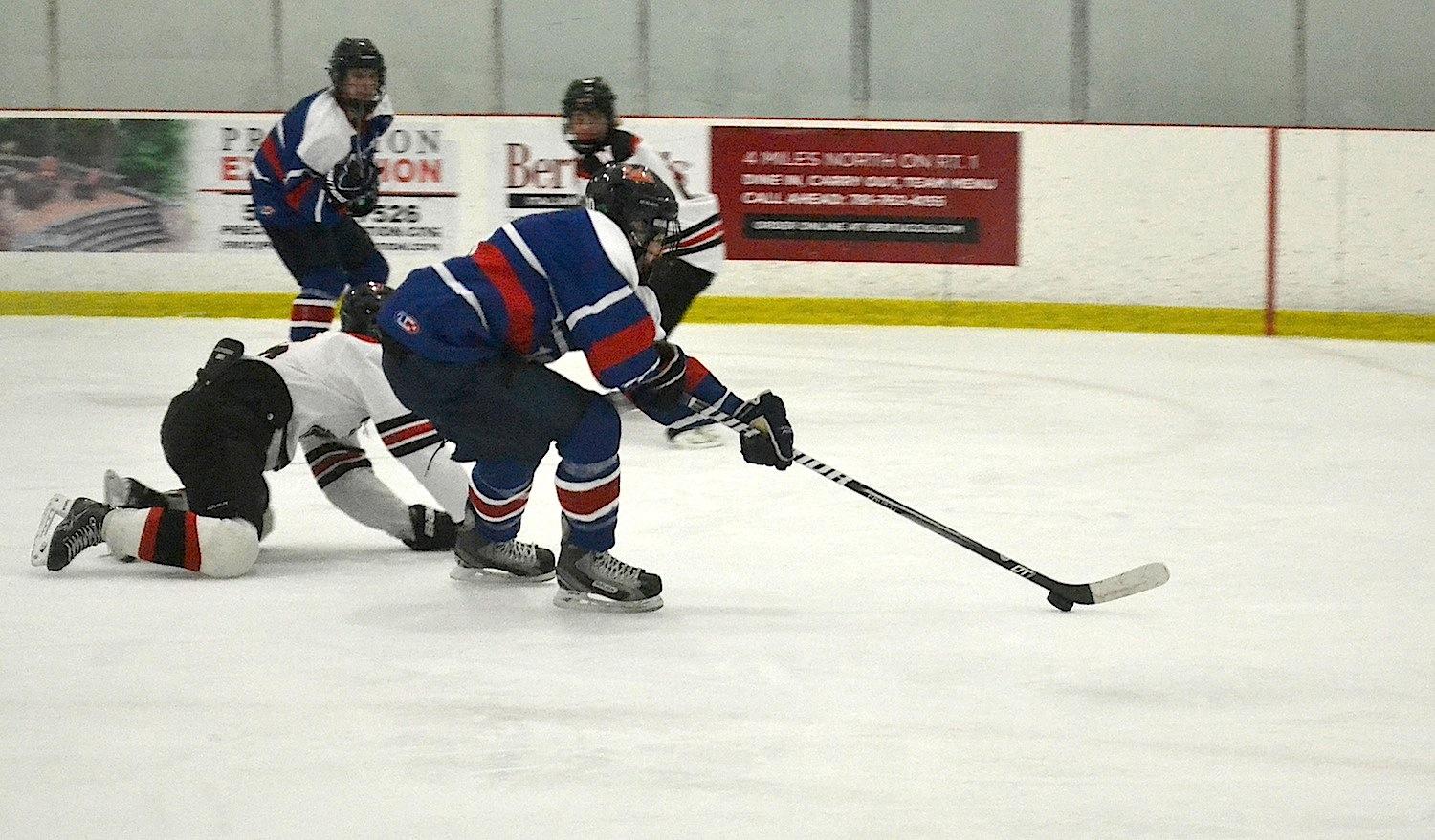 Walpole Senior breaks past a  Wellesley defender.