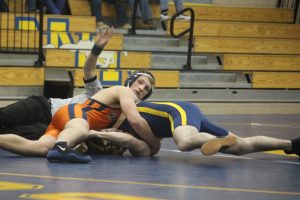 One of the Rebel's senior Captains works to pin his opponent in the 170 pound bout. 