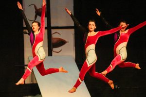 Three dancers perform in the annual Dance Company show.