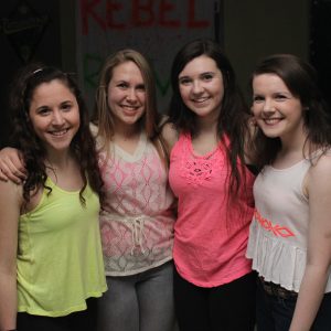 Walpole High School students smile for a picture at the Rebel Rave.