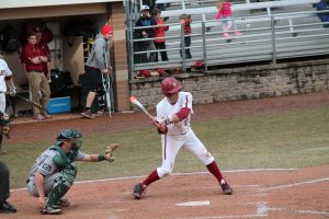 Walpole High School Alumni swings at a ball during a Boston College baseball game. 