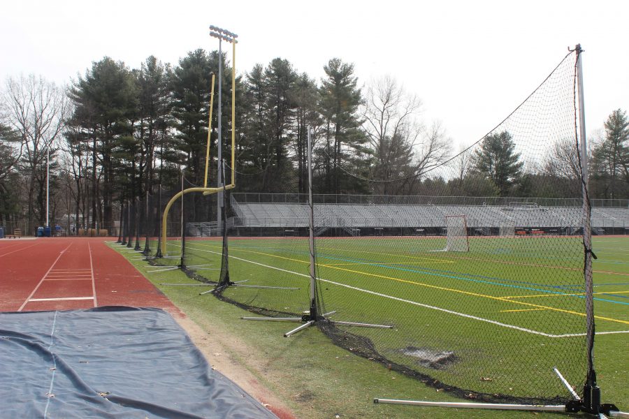 New+end-line+netting+is+placed+behind+each+goal+post+on+the+turf+to+prevent+balls+from+hitting+the+track.