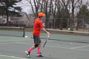 A Walpole tennis player returns a hit. 