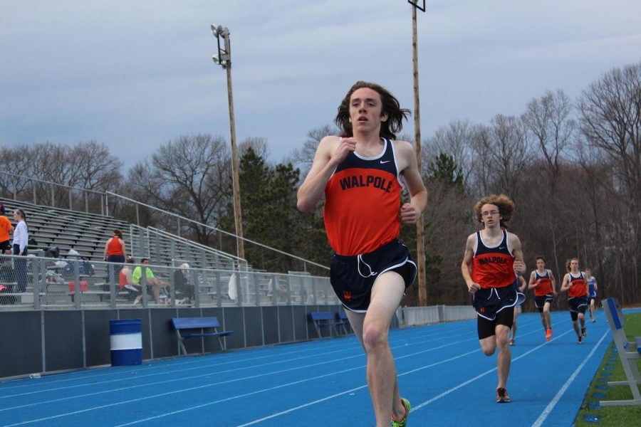 A Walpole long-distance runner finishes his race. 