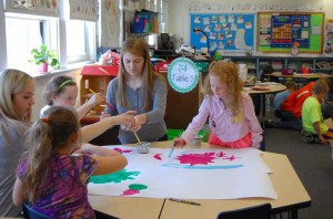 Walpole High students make art with Elementary schoolers. 