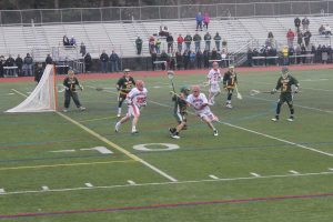 A Walpole attack battles a defender for possession.