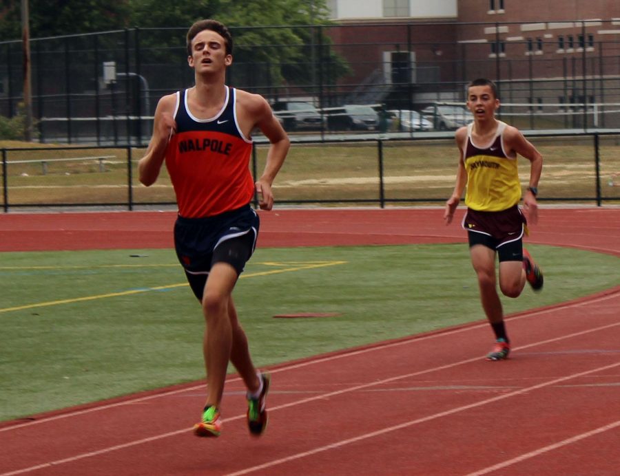 In an earlier meet, senior runner out-kicks an opponent from Weymouth (Photo/ Max Simons)