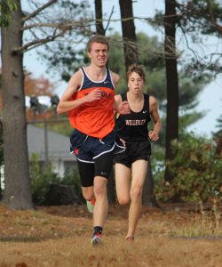 A Rebel runner outkicks a Wellesley runner to secure 3rd Place. (Photo/ Kaitlin Brown)