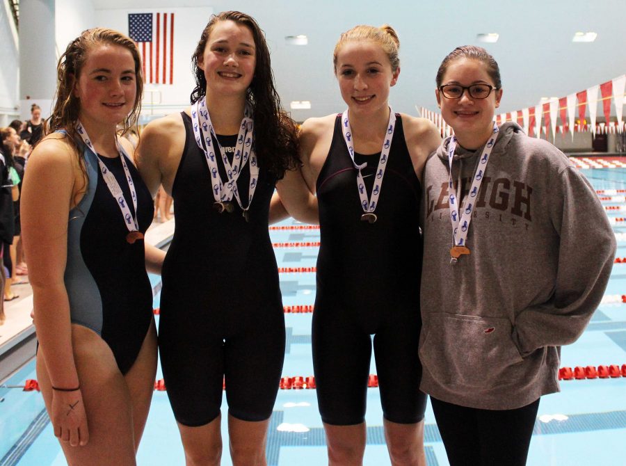 Walpoles 200-yard freestyle team poses with their medals.
