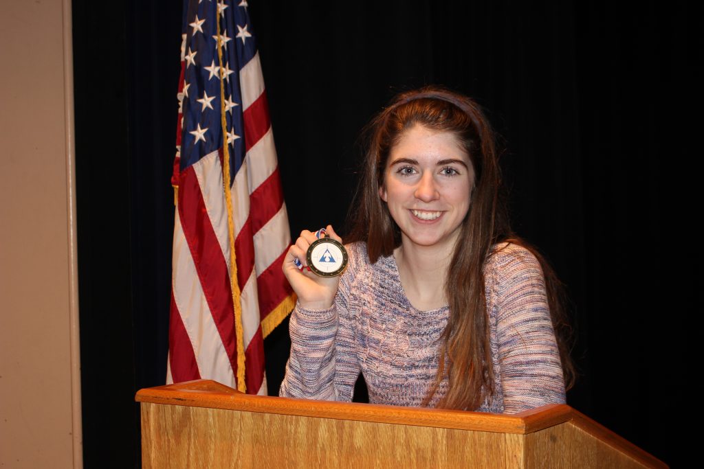 Junior Tess Lancaster showcases her medal from her last competition.  Tess will compete at the Grand National Tournament in Fort Lauderdale, FL this May. 