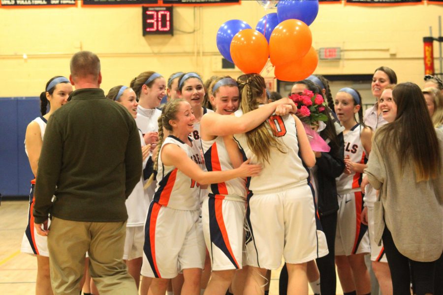 Walpole+Alum+Summer+King+being+congratulated+by+her+teammates+and+coach+for+surpassing+the+1000+points+mark+in+basketball.