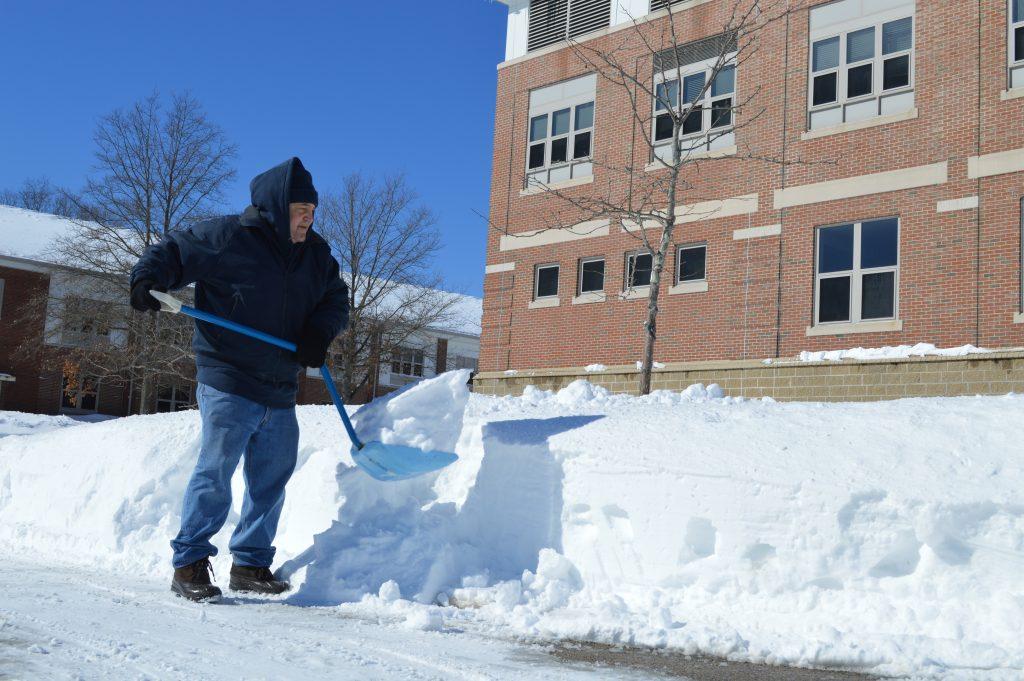 A Walpole High School Custodian shovels the sidewalks during February vacation to ensure that athletes can practice. 