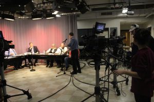 The Walpole School Committee gathers in the TV studio for a meeting broadcasted across town.