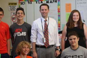 Mr. Hahn poses with students as he is recognized for becoming the new principal at Johnson Middle School Photo/ James Randall 