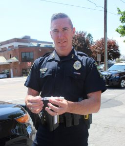 Officer Carmichael holds the Narcan— a brand name for the drug Naloxne, which is administered to individuals who have overdosed on heroine.