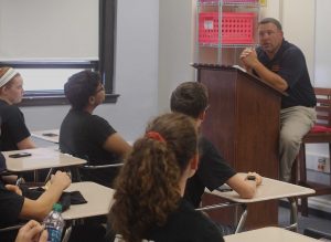 Mr. Dowd speaks to team captains about school and athletic issues. He plans to meet with captains monthly. 