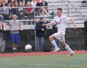 Sophomore Billy Porter runs onto a ball during Walpole's 2-1 loss to Medfield.